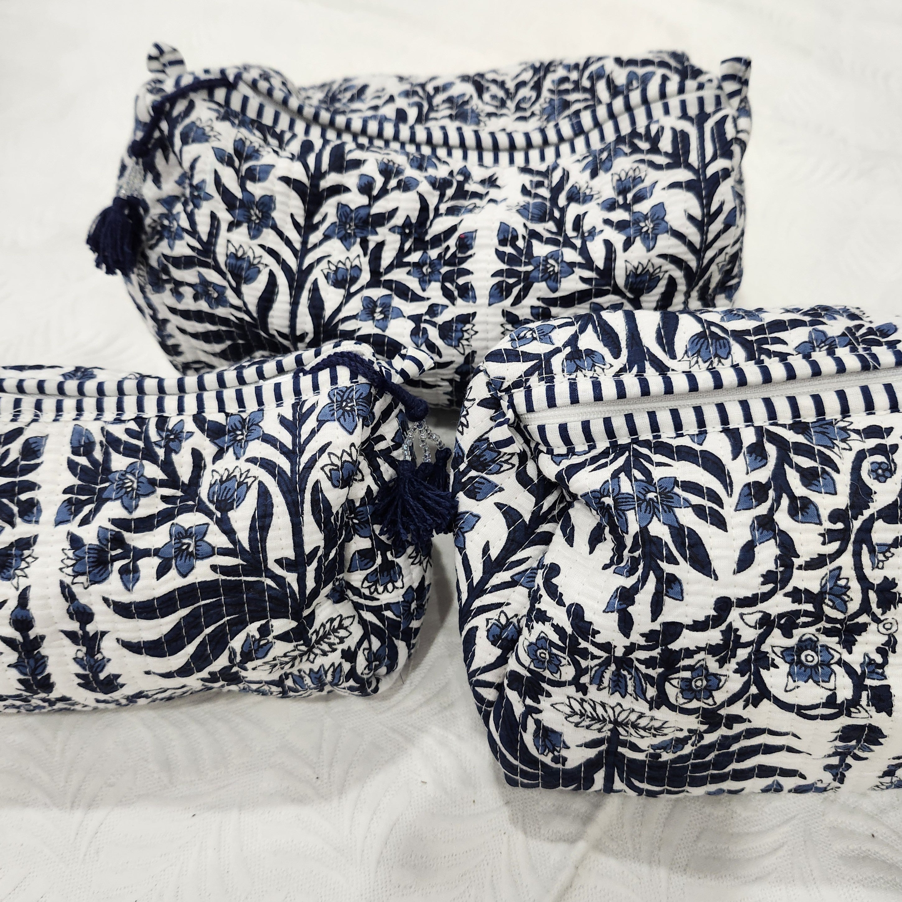 Floral blue block-print wash bag with a tassel zip