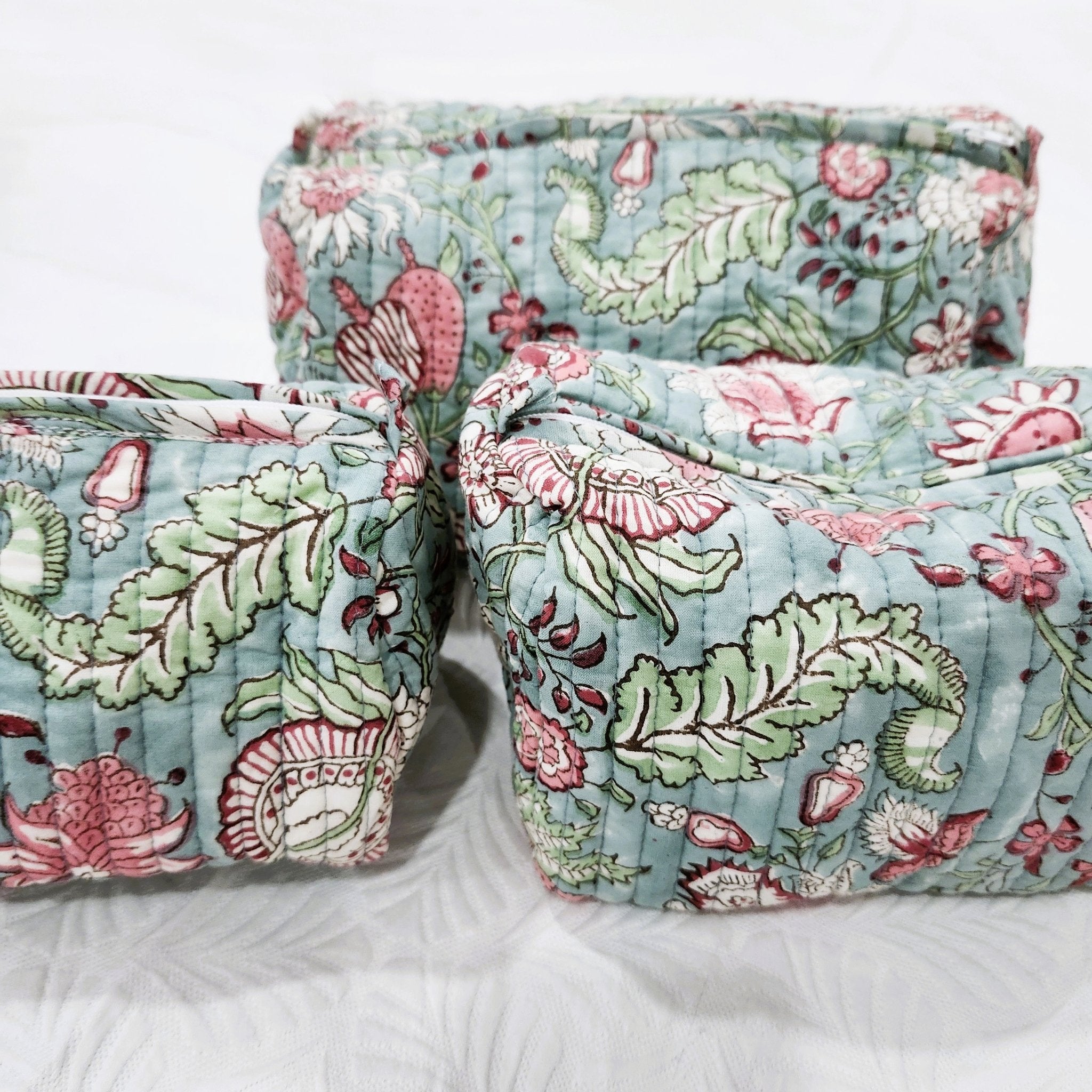 Hibiscus block-print wash bag with a tassel zip