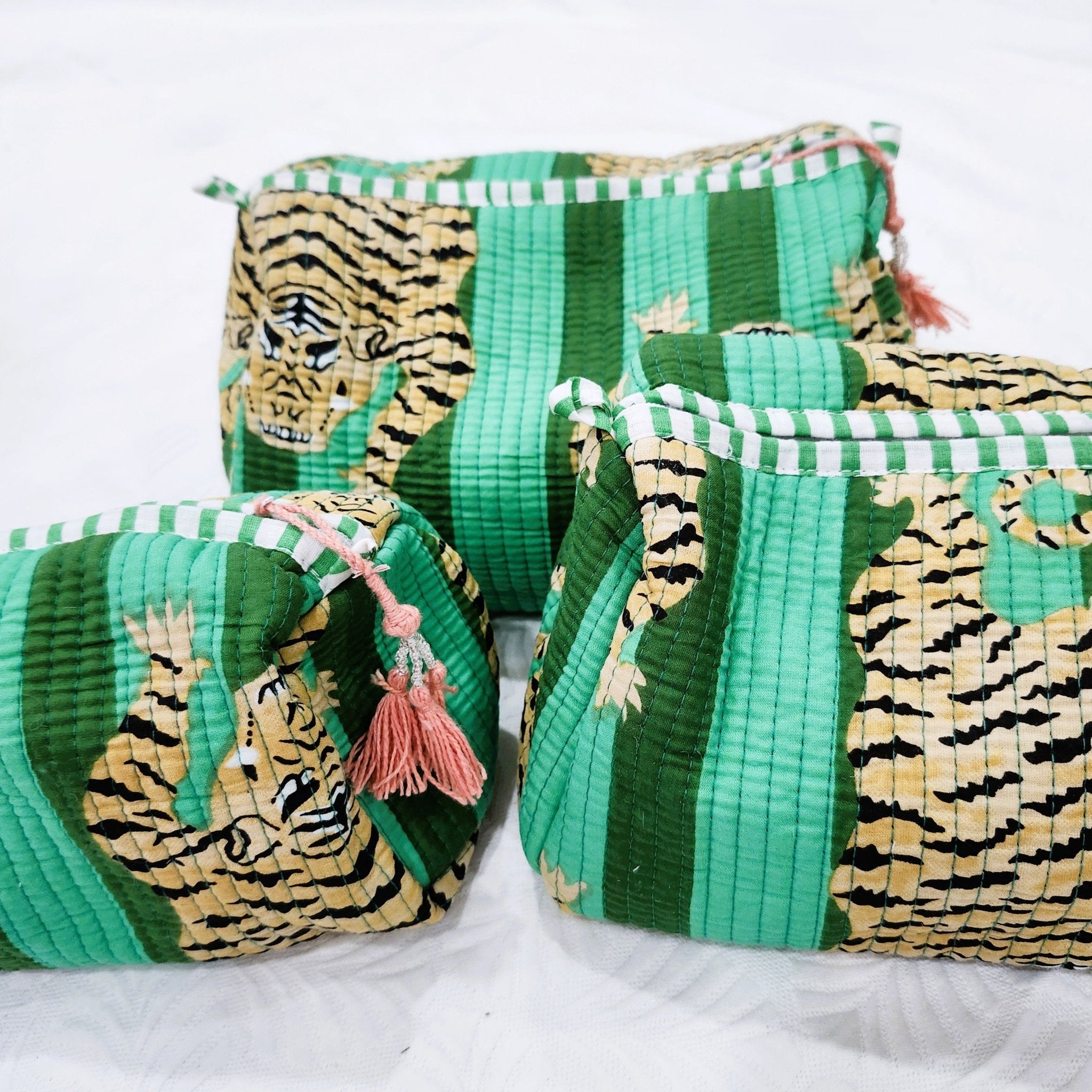 Tiger block-print wash bag in emerald