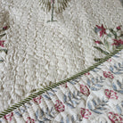 Quilted palm and flower block-print bedspread in muted shades