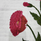 Reverse of the poppy bedspread, showing the green striped block print backing in 100 per cent cotton.