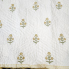 Child's block-print cotton quilt with a large yellow marigold print, machine washable, 102 x 152 cm