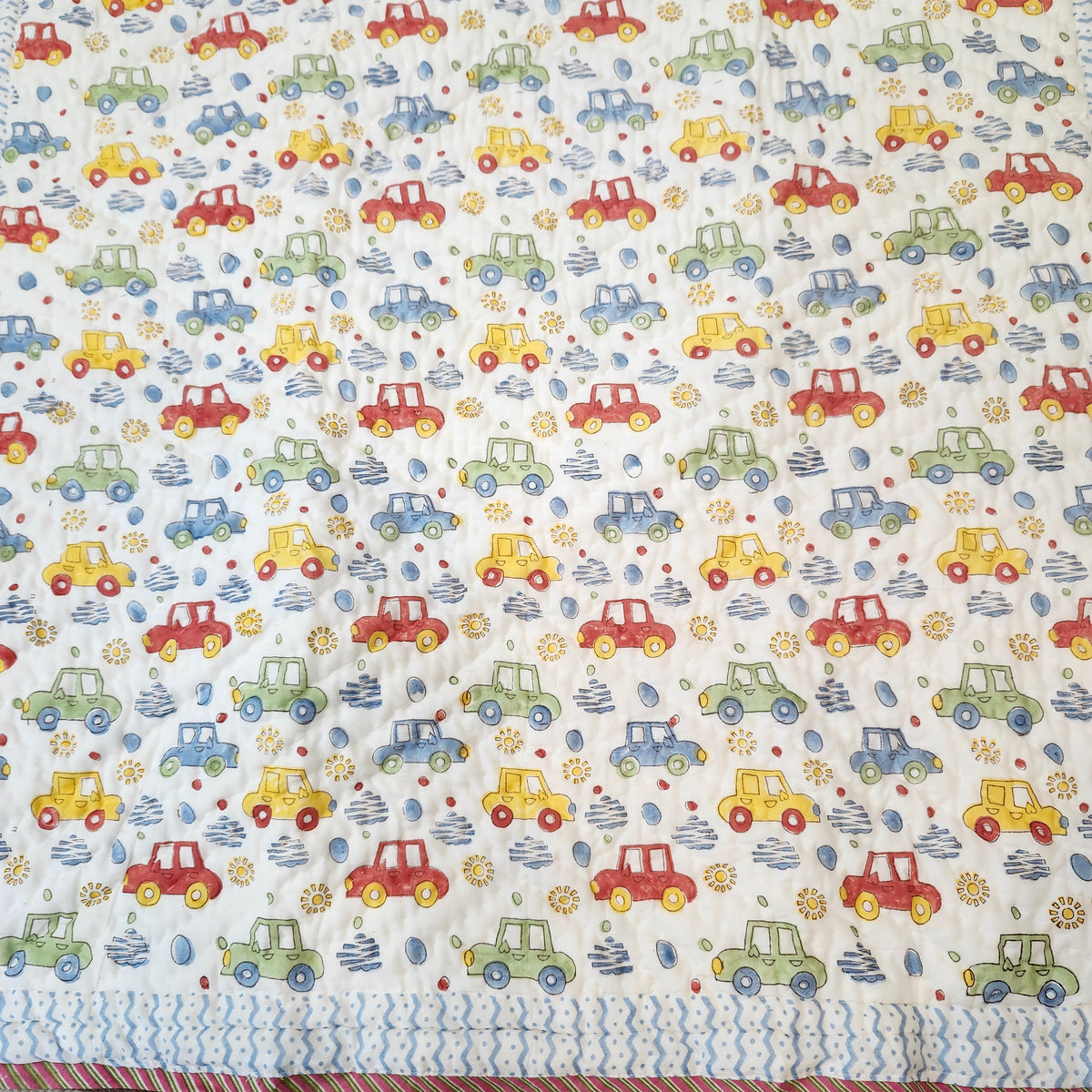 Colourful car block-print cotton quilt for children, suitable from age three, detail of the print