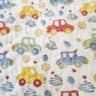 Car-print child's quilt, reverse side with a blue trellis pattern, reversible organic cotton cambric