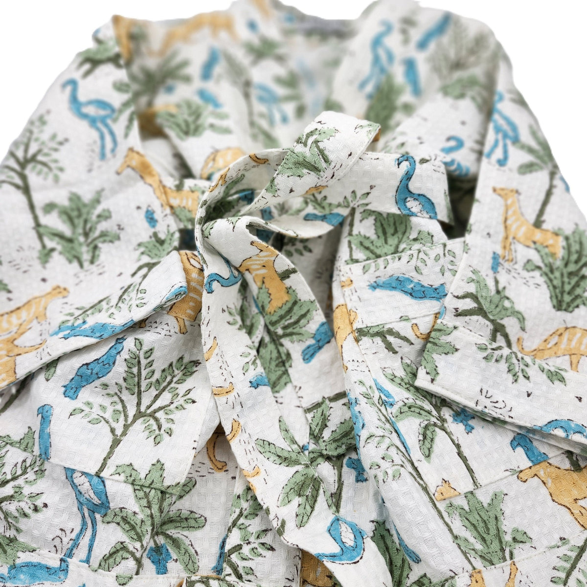 Jungle print child's bath robe in cotton waffle, with two handy pockets and a belt, quick to dry for the bath, pool or beach