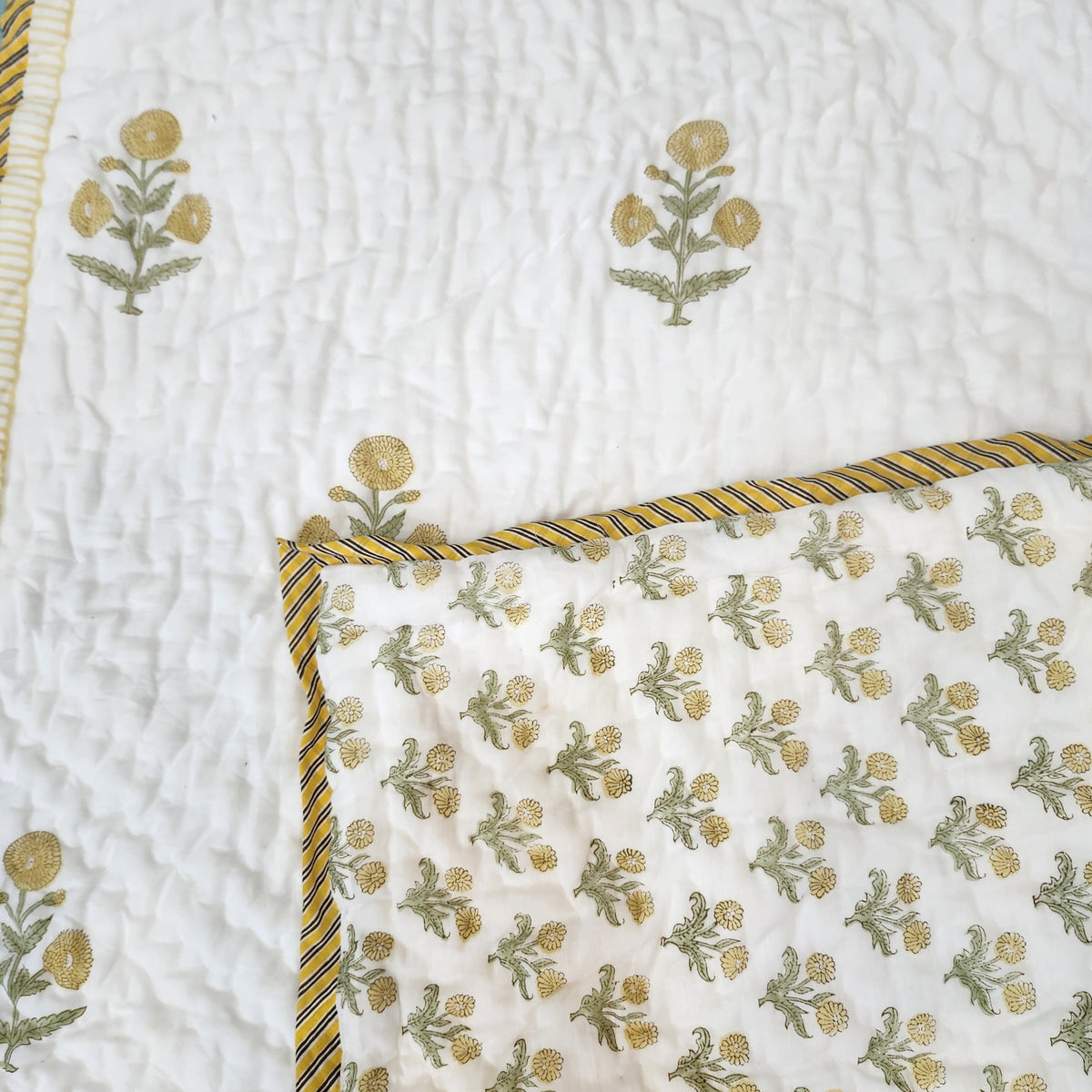 Marigold block-print quilt for children in yellow, detail view