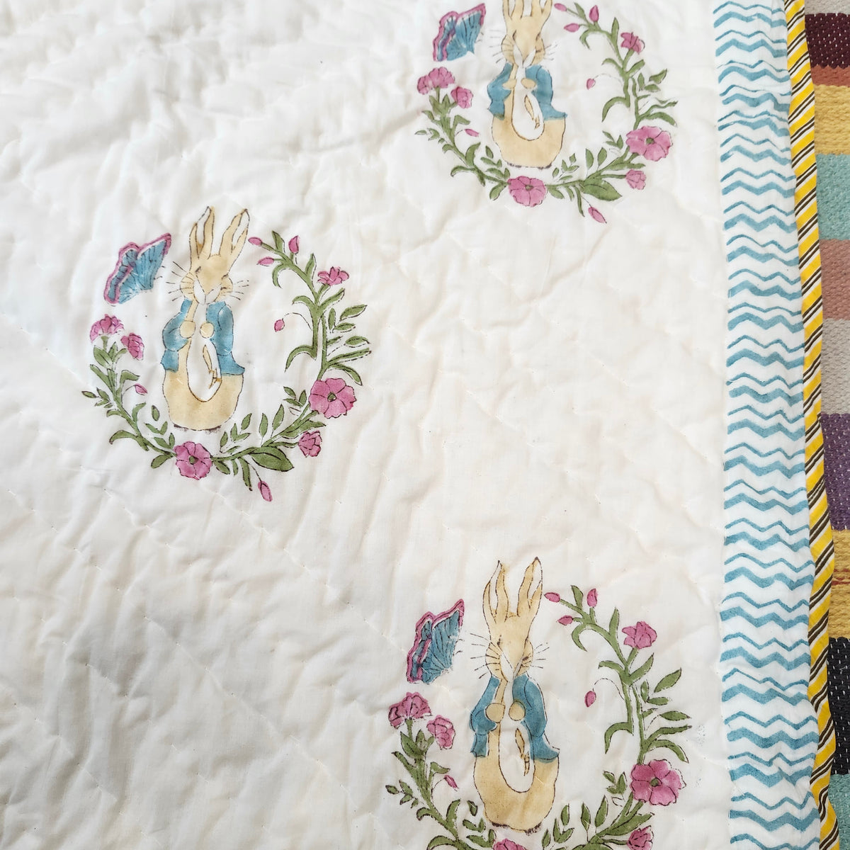 Peter Rabbit block-print cotton quilt for children, detail of the print