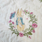 Child's block-print organic cotton quilt with an adorable Peter Rabbit print, machine washable