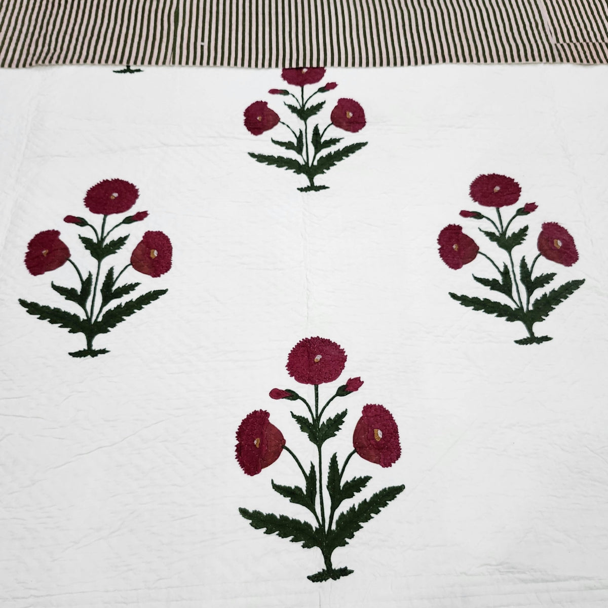 King size poppy bedspread, 260 by 260cm, block printed and quilted entirely by hand in cotton.