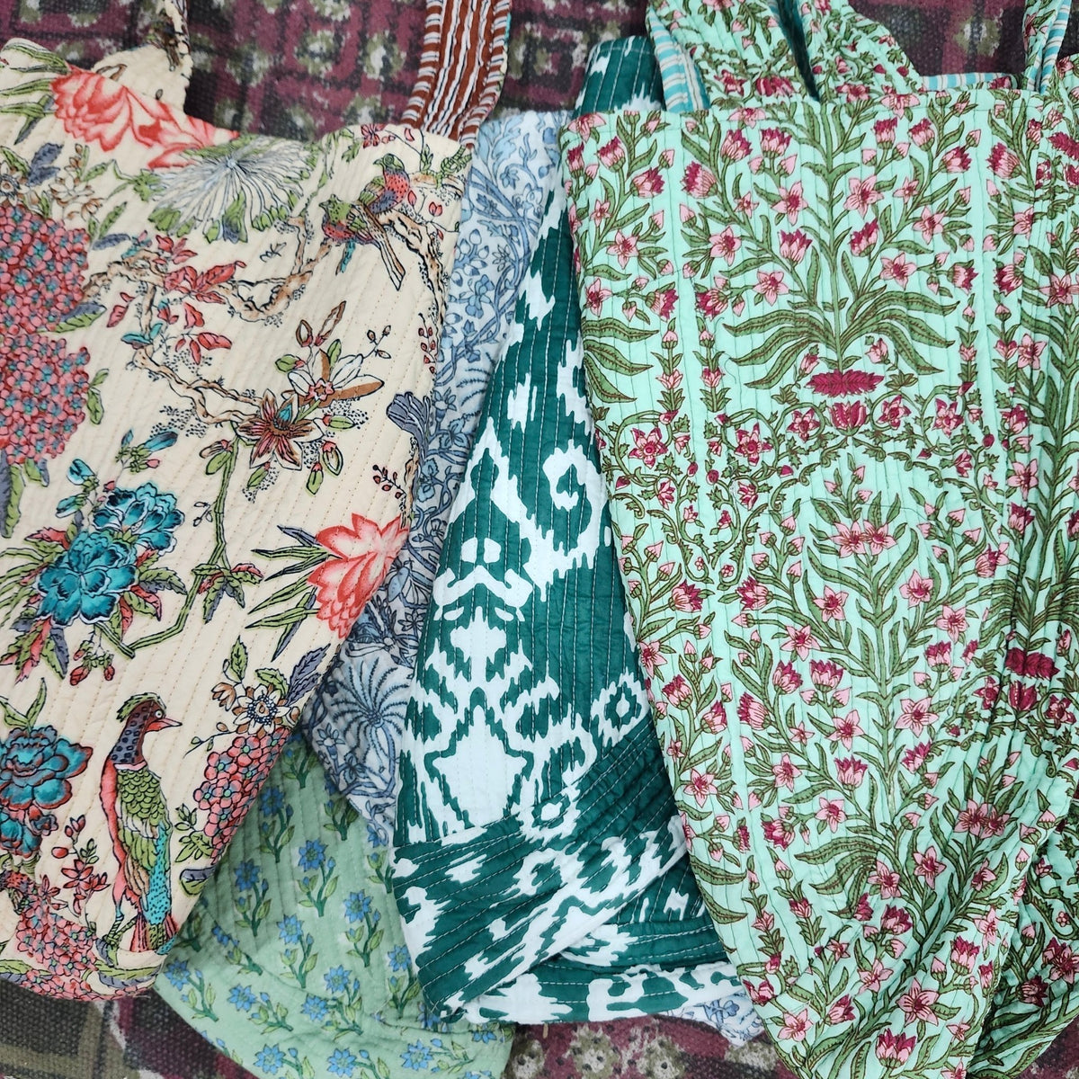 Block print cotton bag, V shaped with two shoulder handles and side ties, 55cm wide by 40cm high.