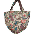 The block print bag with its side ties knotted together, showing an alternative way to wear it.