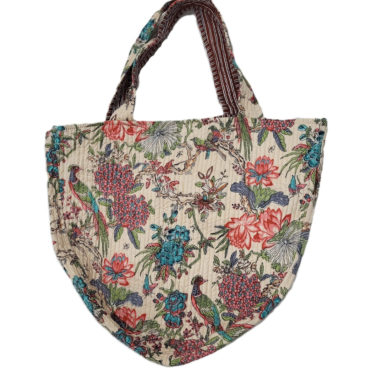 The block print bag with its side ties knotted together, showing an alternative way to wear it.