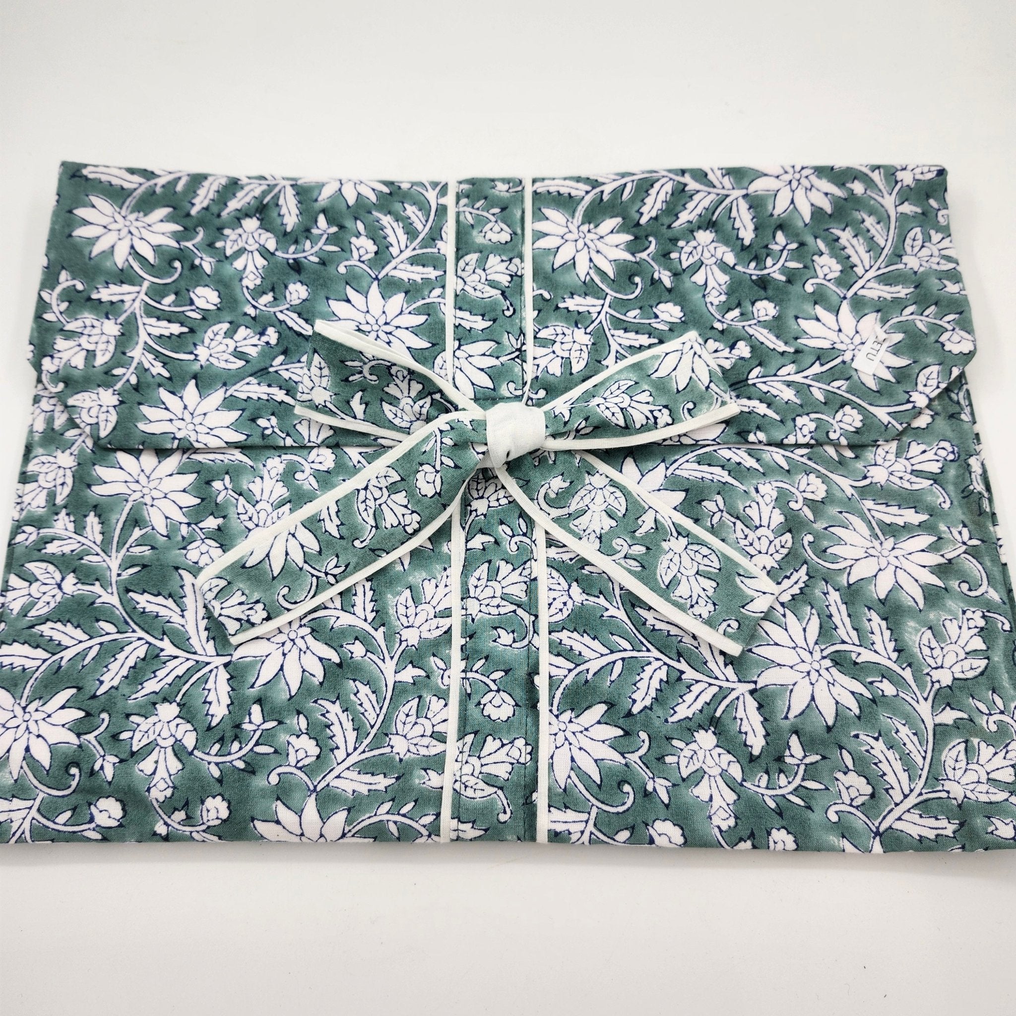 Teal floral pyjama set with a matching envelope bag