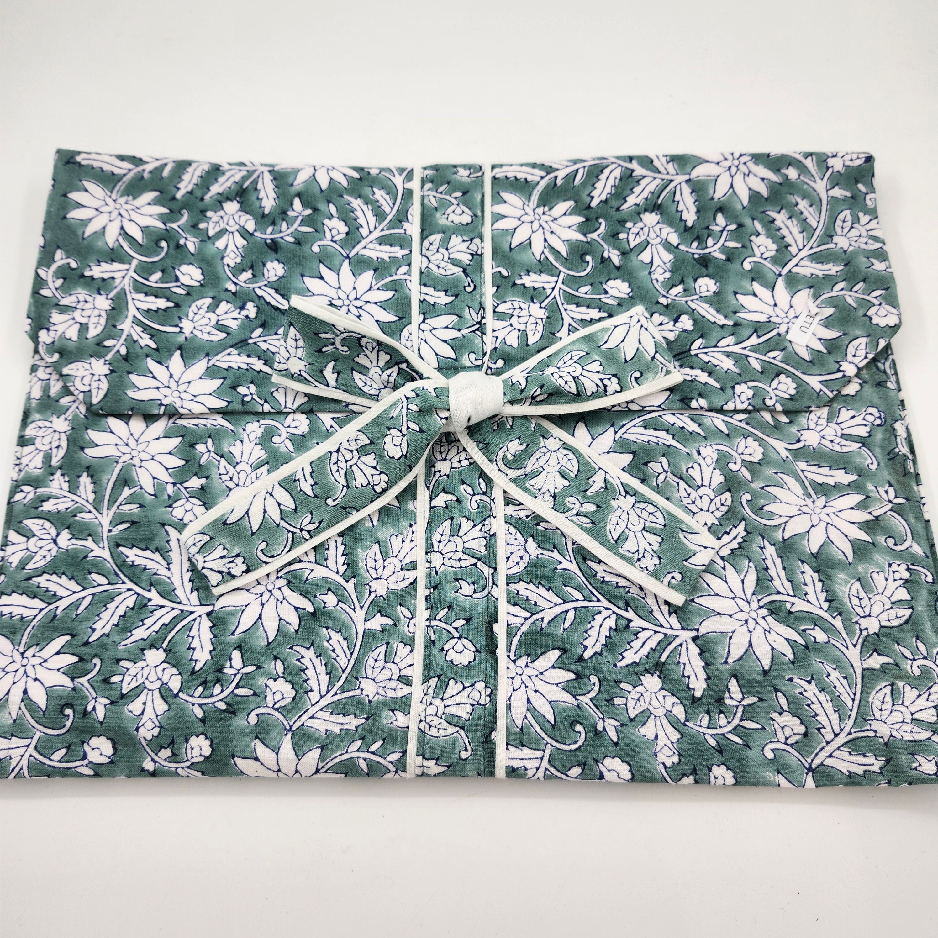 Teal floral pyjama set with a matching envelope bag