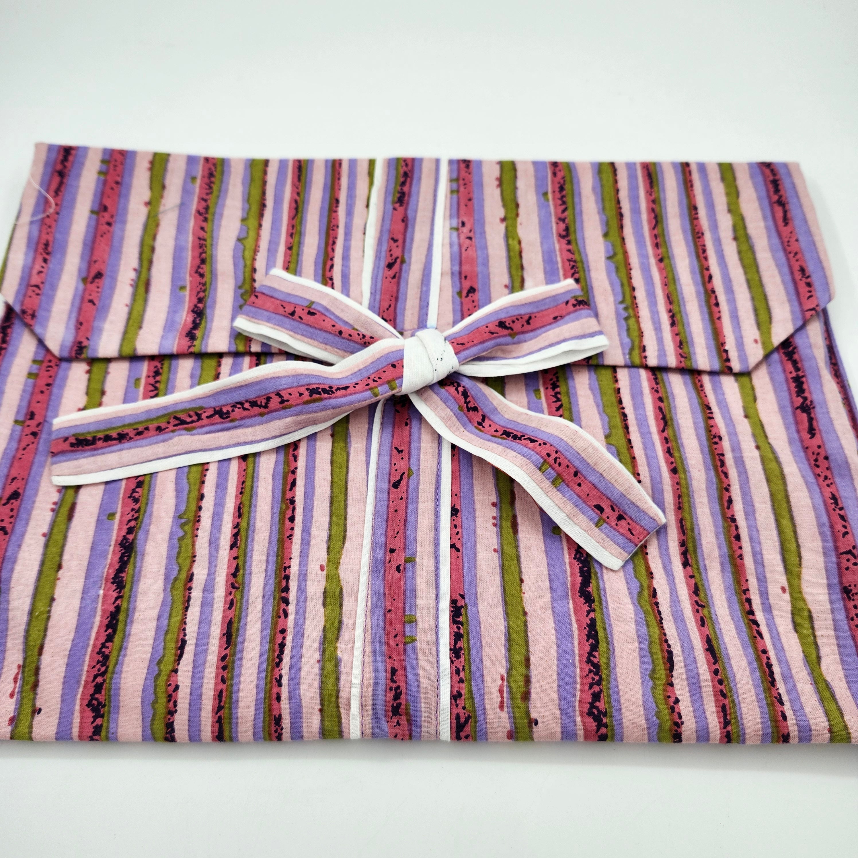 Pink and green stripe pyjama set with a matching envelope bag