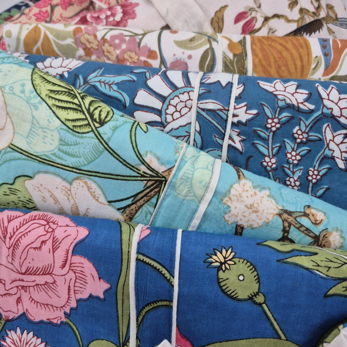 Assorted floral block print long pyjamas in cotton cambric, long-sleeved top with a pocket and contrast trim.