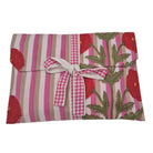 Poppy print long pyjamas with a pocket on the buttoned top and drawstring bottoms, in block printed cotton cambric