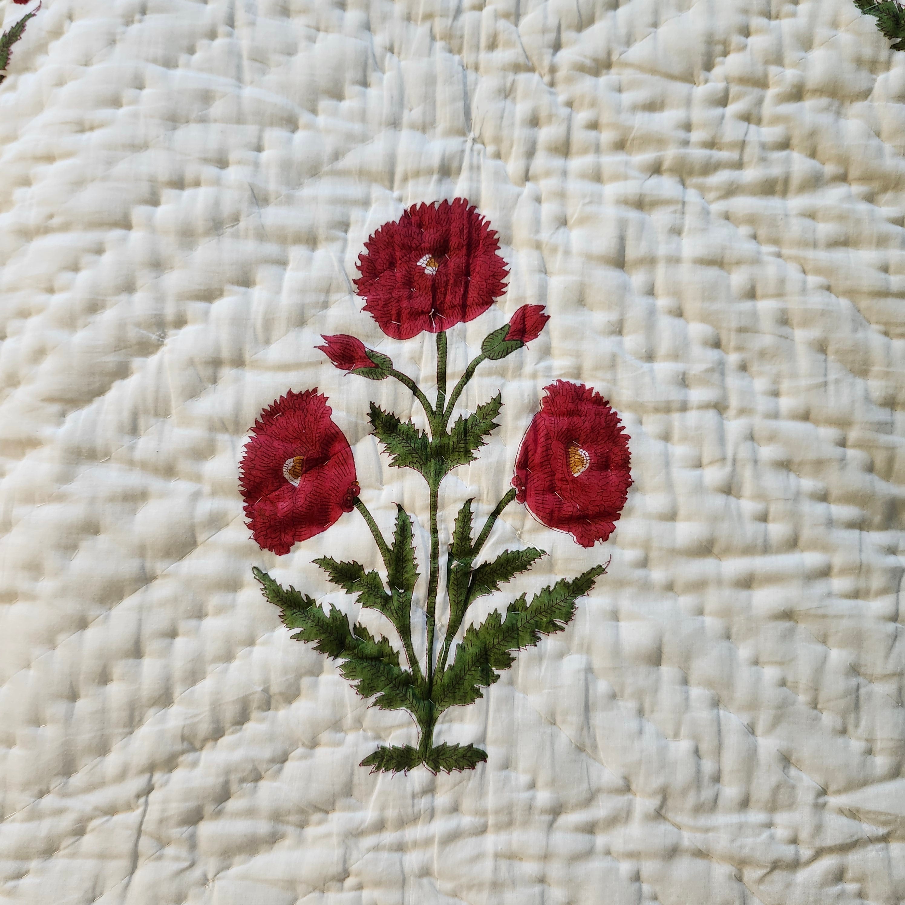 Botanical poppy block-print quilt, red and green floral reverse
