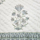 Single block-print quilt with a soft blue dahlia pattern, reversible cotton