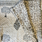 Mango tree block-print quilt with a swirly reverse