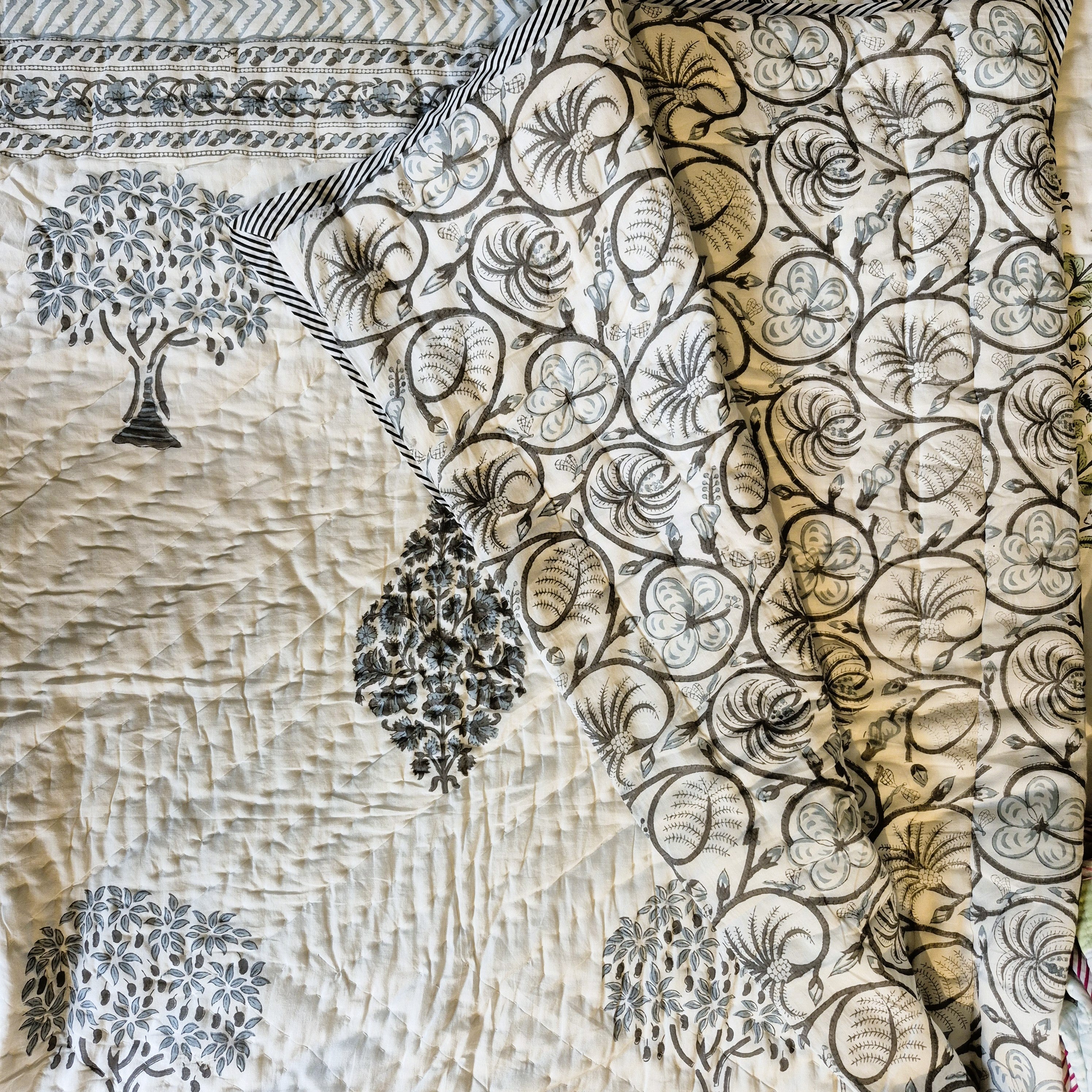 Mango tree block-print quilt with a swirly reverse