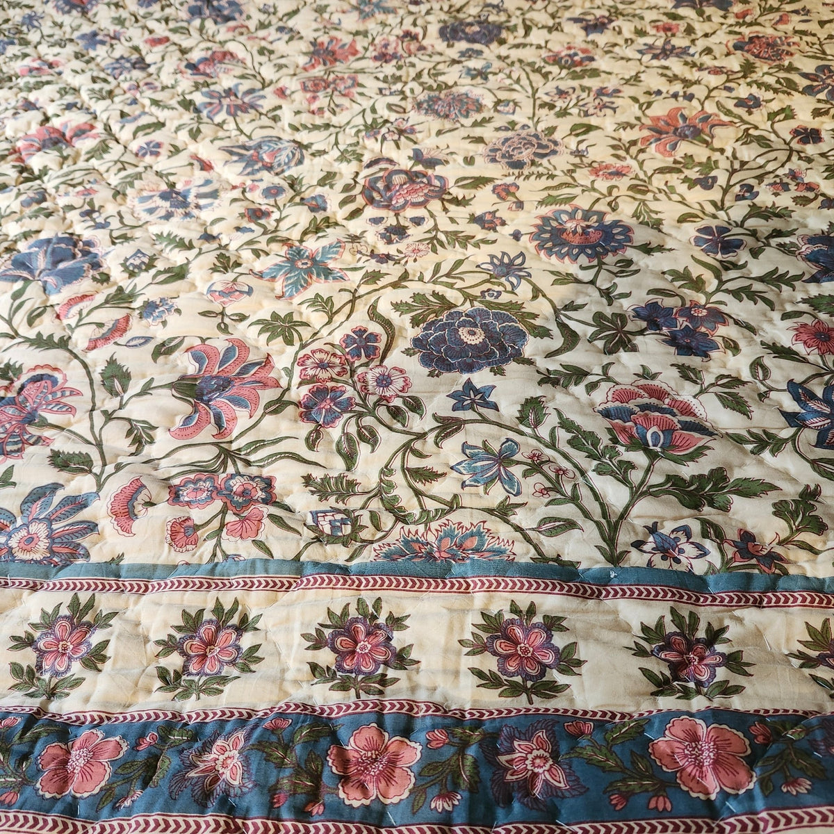 Beige Mughal queen size block print quilt in 100% cotton, a floral print on one side and a patterned reverse, 228 by 275cm
