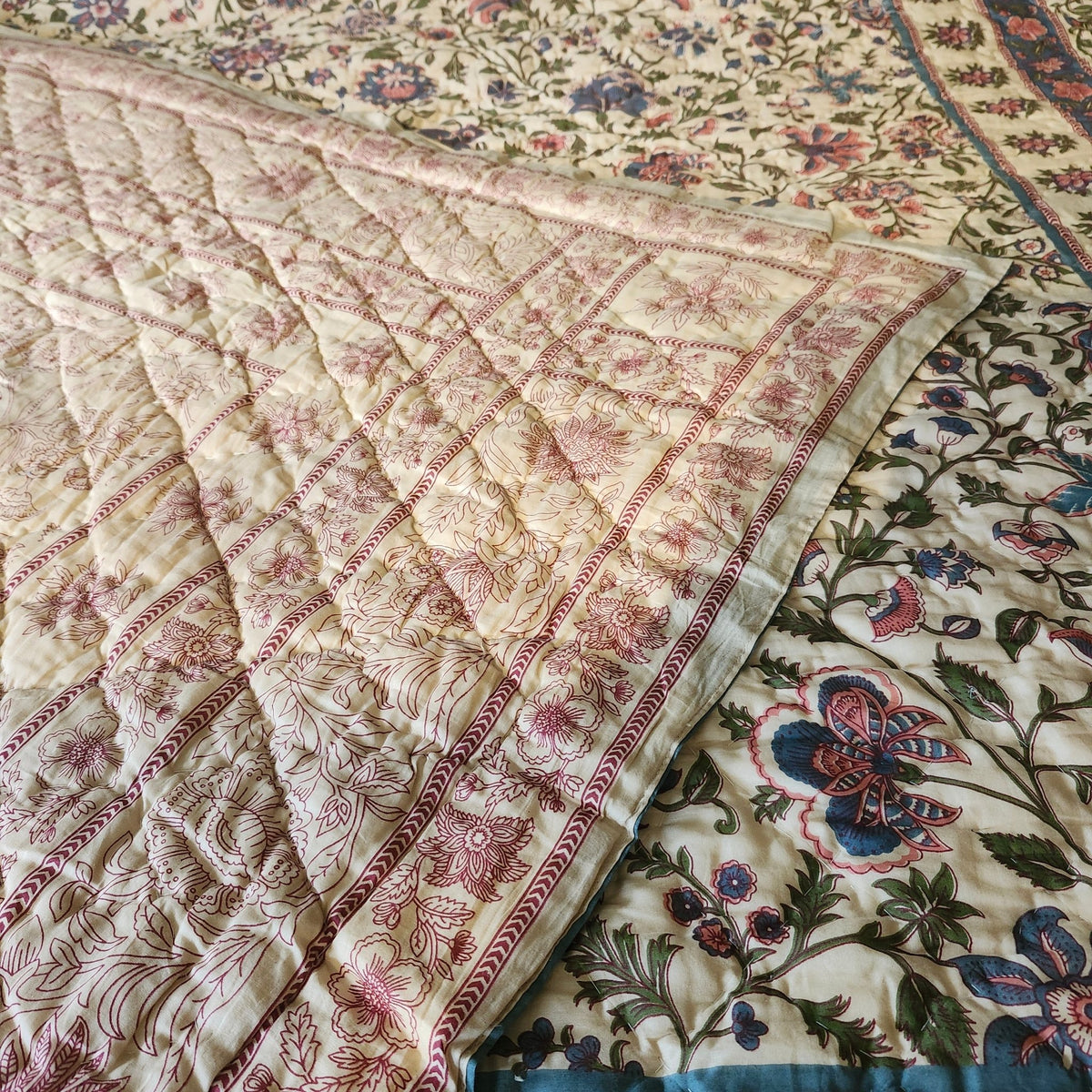 Alternative view of the beige Mughal quilt, showing the patterned reverse, hand block printed so each piece varies slightly