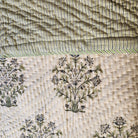 Lime and blue striped reverse of the block-print quilt