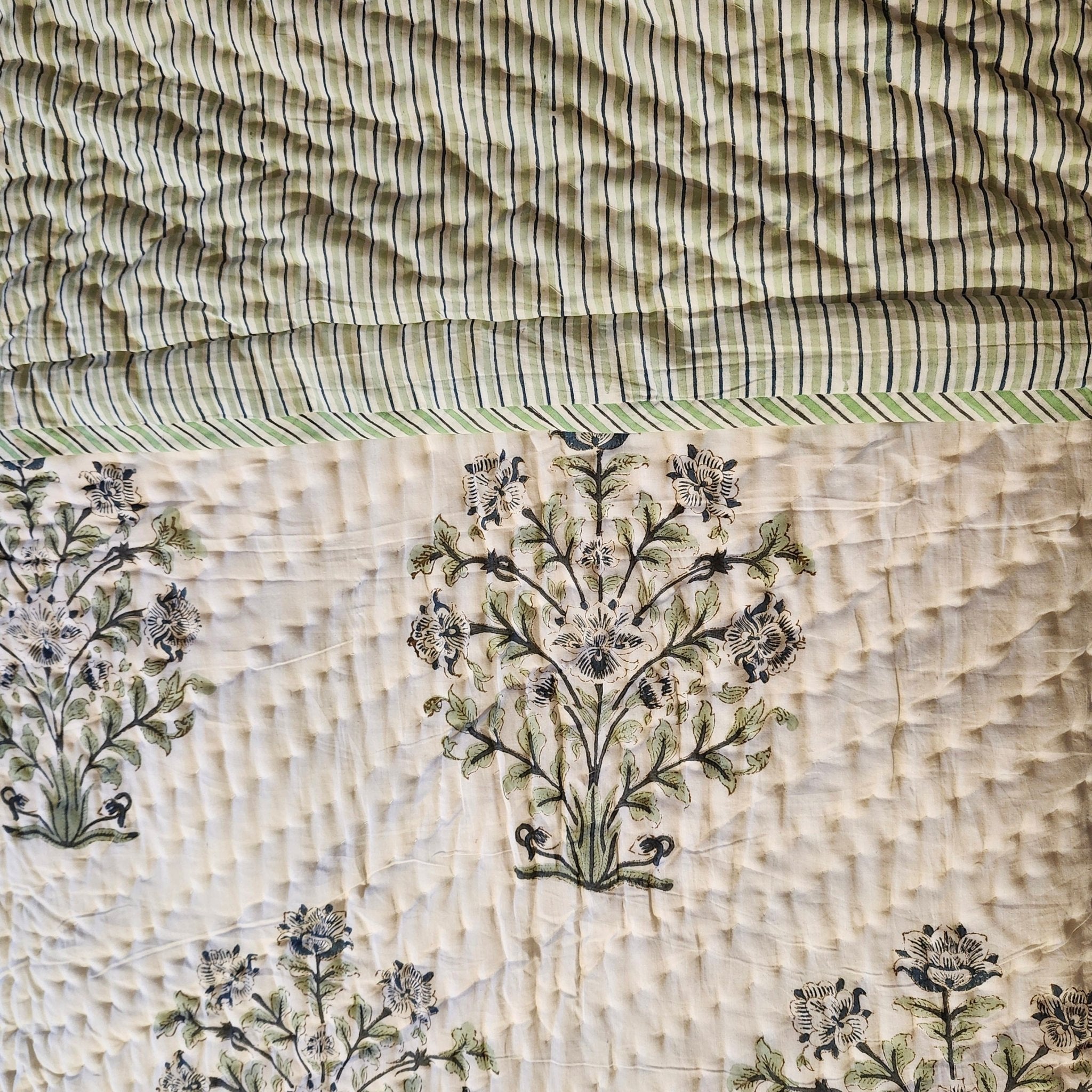 Lime and blue striped reverse of the block-print quilt