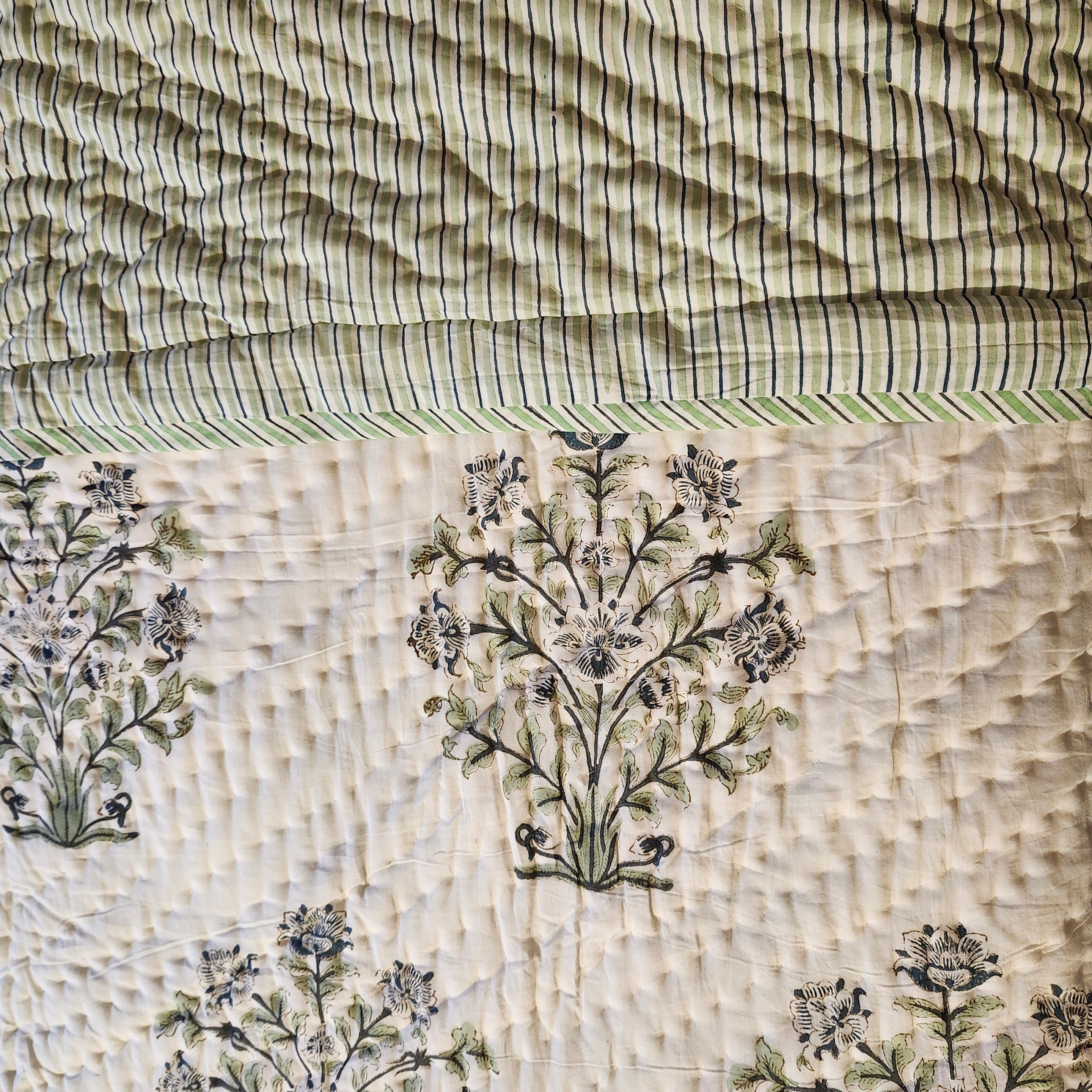 Lime and blue striped reverse of the block-print quilt