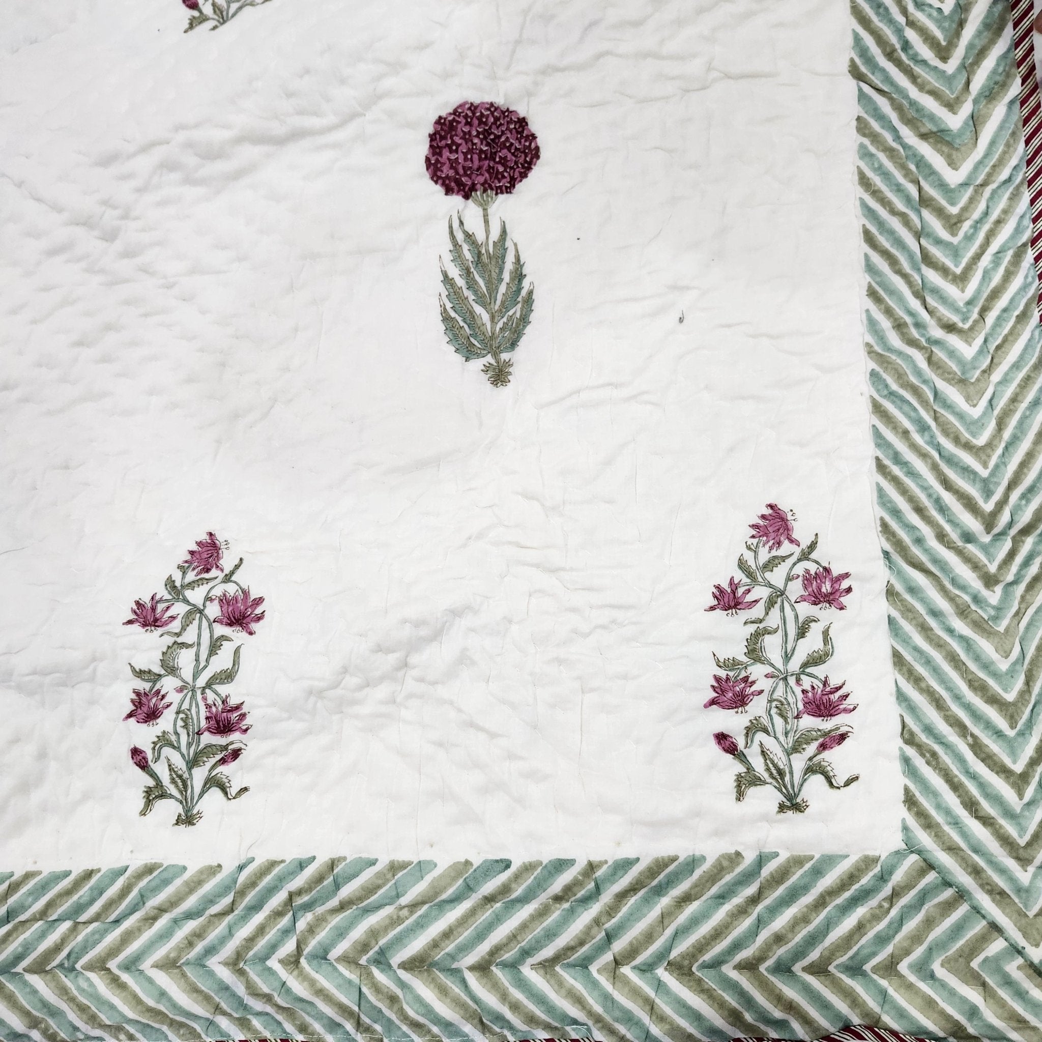 Cream, green and pink block-print quilt