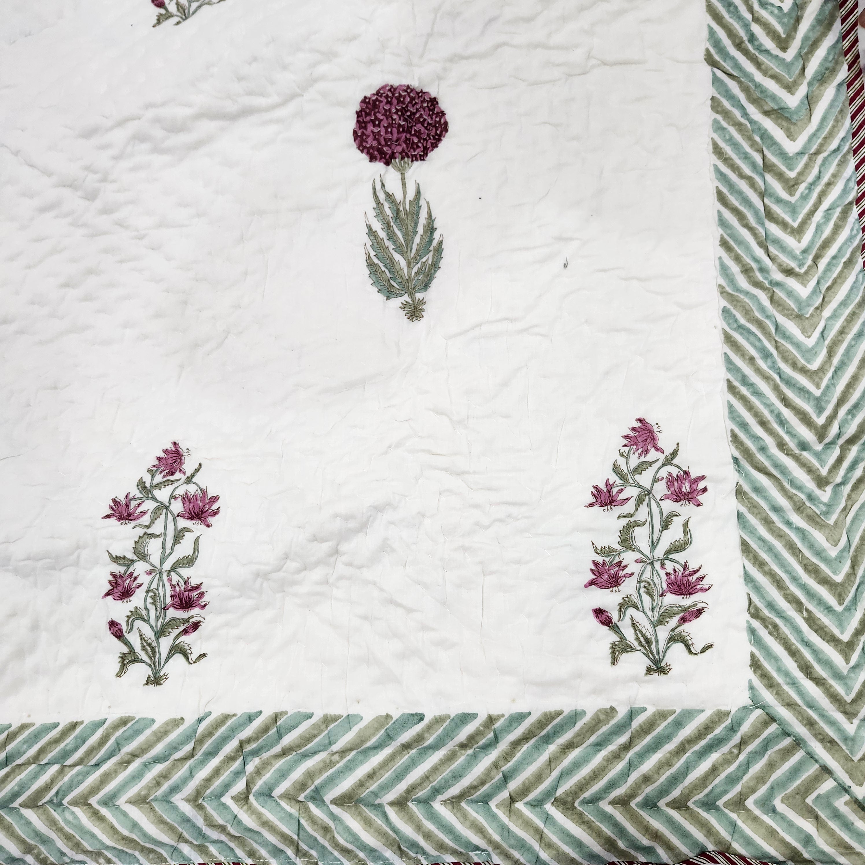 Cream, green and pink block-print quilt