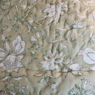Traveller's palm block-print quilt with a striped border