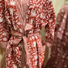 Red and white block print cotton robe, toning belt and trim, styled
