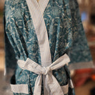 Teal floral block print cotton bathrobe, pale blue and white trim, detail view