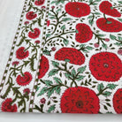 Block Print Tablecloth with red poppy flowers and green leaves on a white background