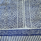 Blue and white patterned block print tablecloth with geometric designs