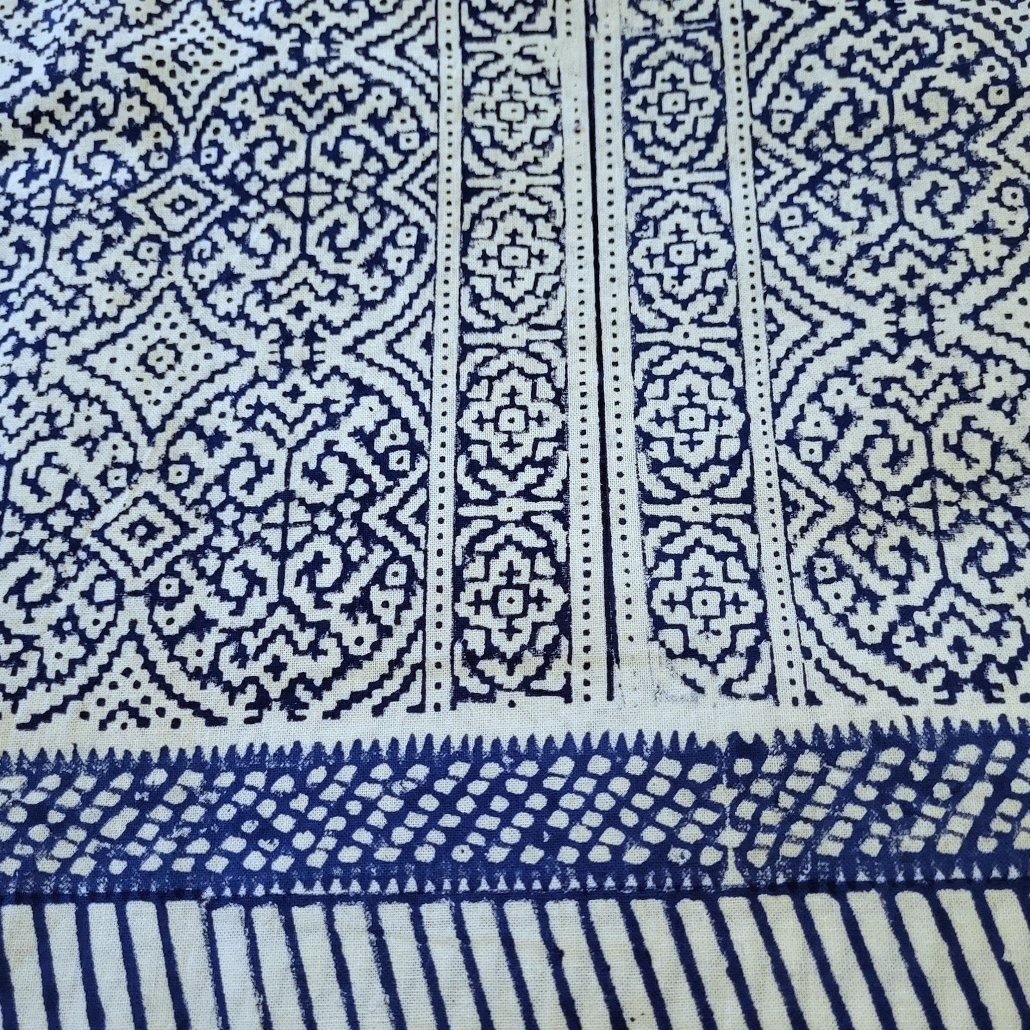 Blue and white patterned block print tablecloth with geometric designs