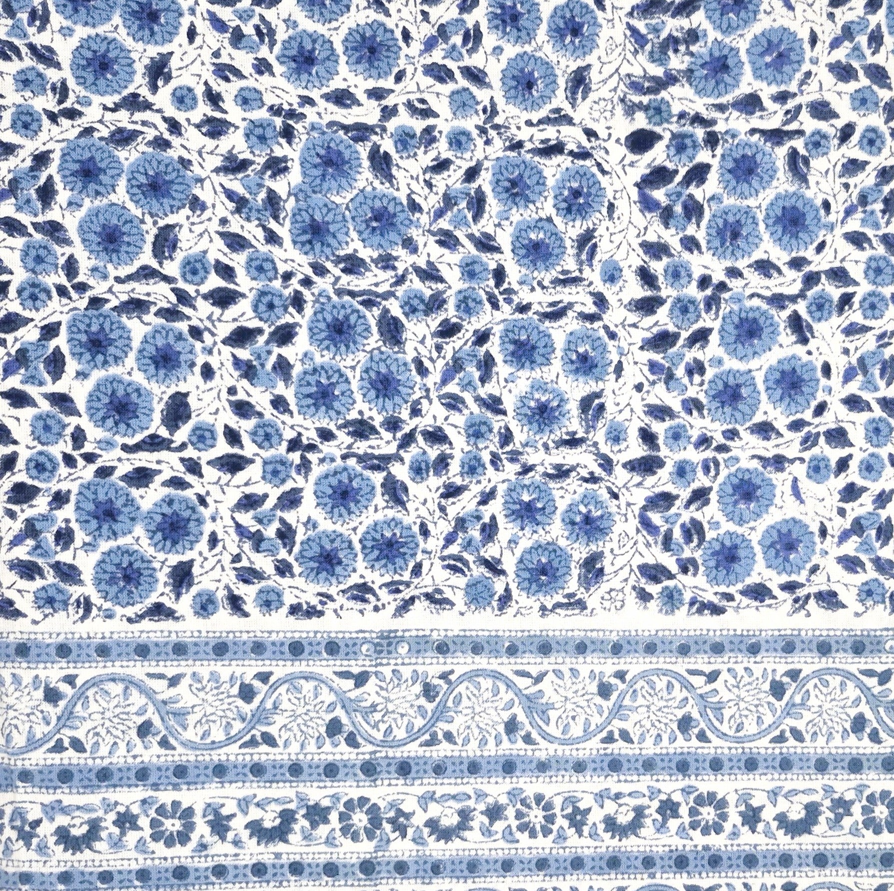 Blue and white daisy block-print cotton tablecloth with a contrast border