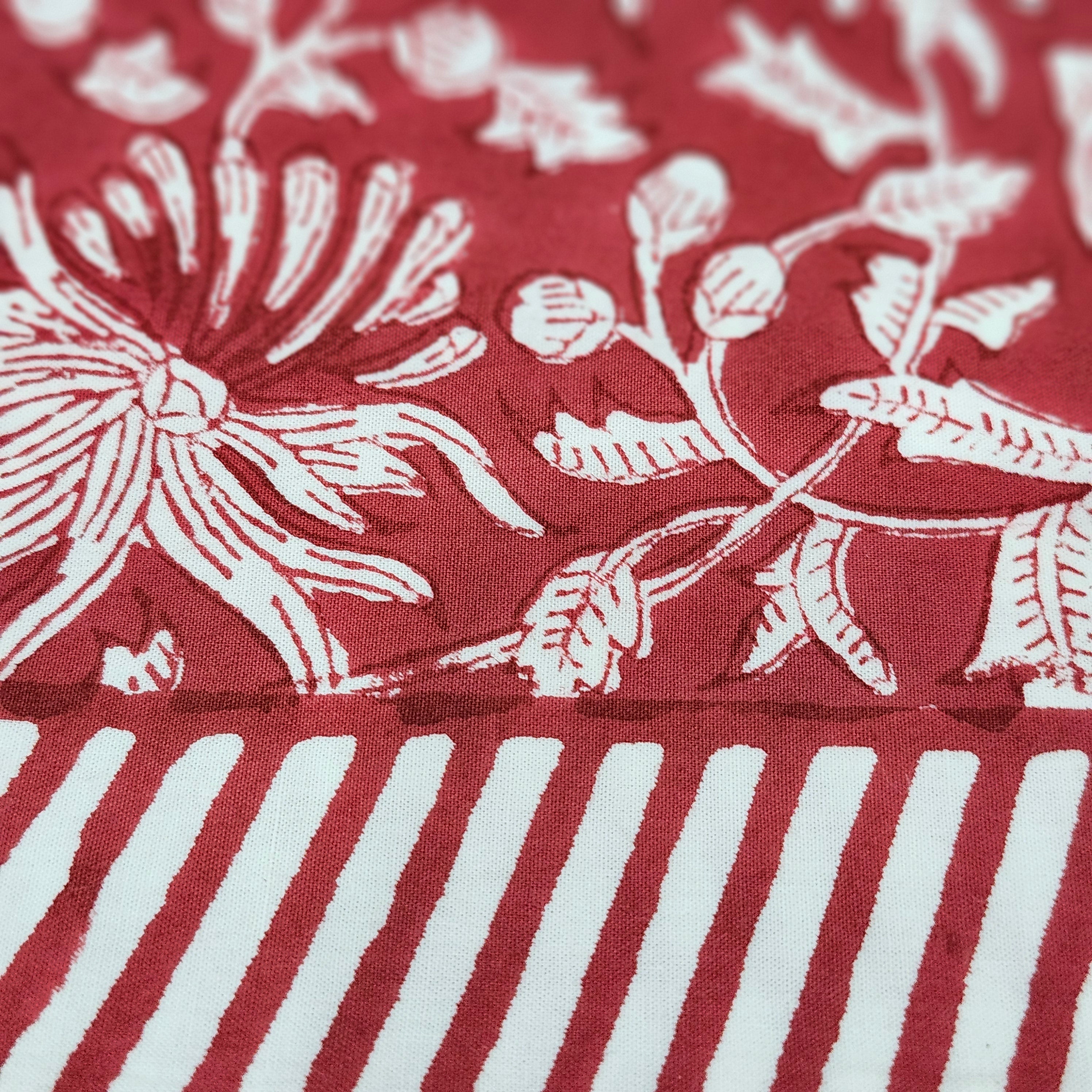 Festive red block-print cotton tablecloth with white flowers and foliage