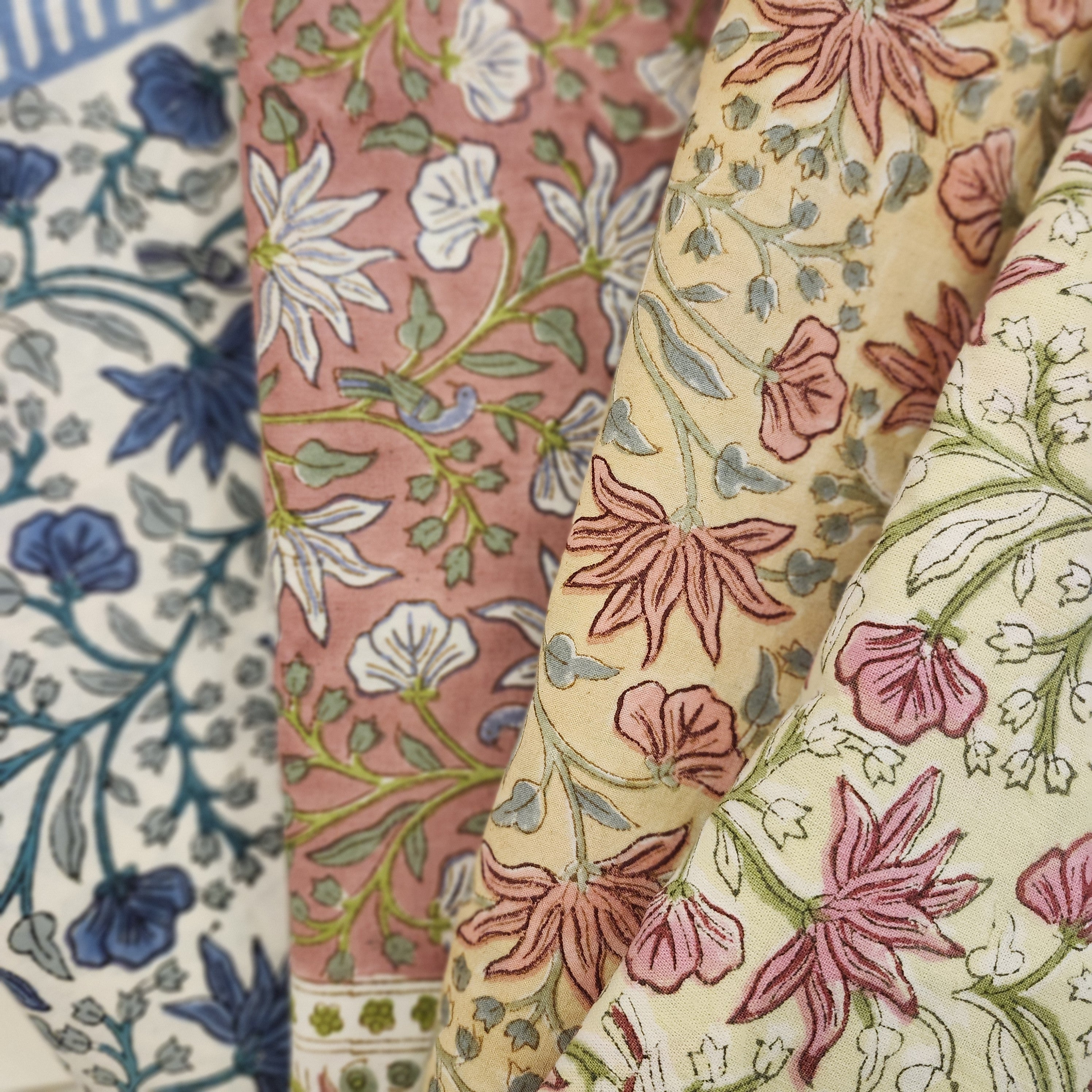 Close-up of Little Bird block print tablecloths in various colors.
