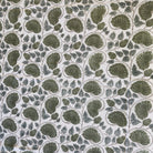 Lotus Patterned tablecloth with green leaves on a white background