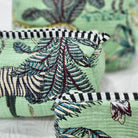 Safari block-print wash bag in green with animals and palms