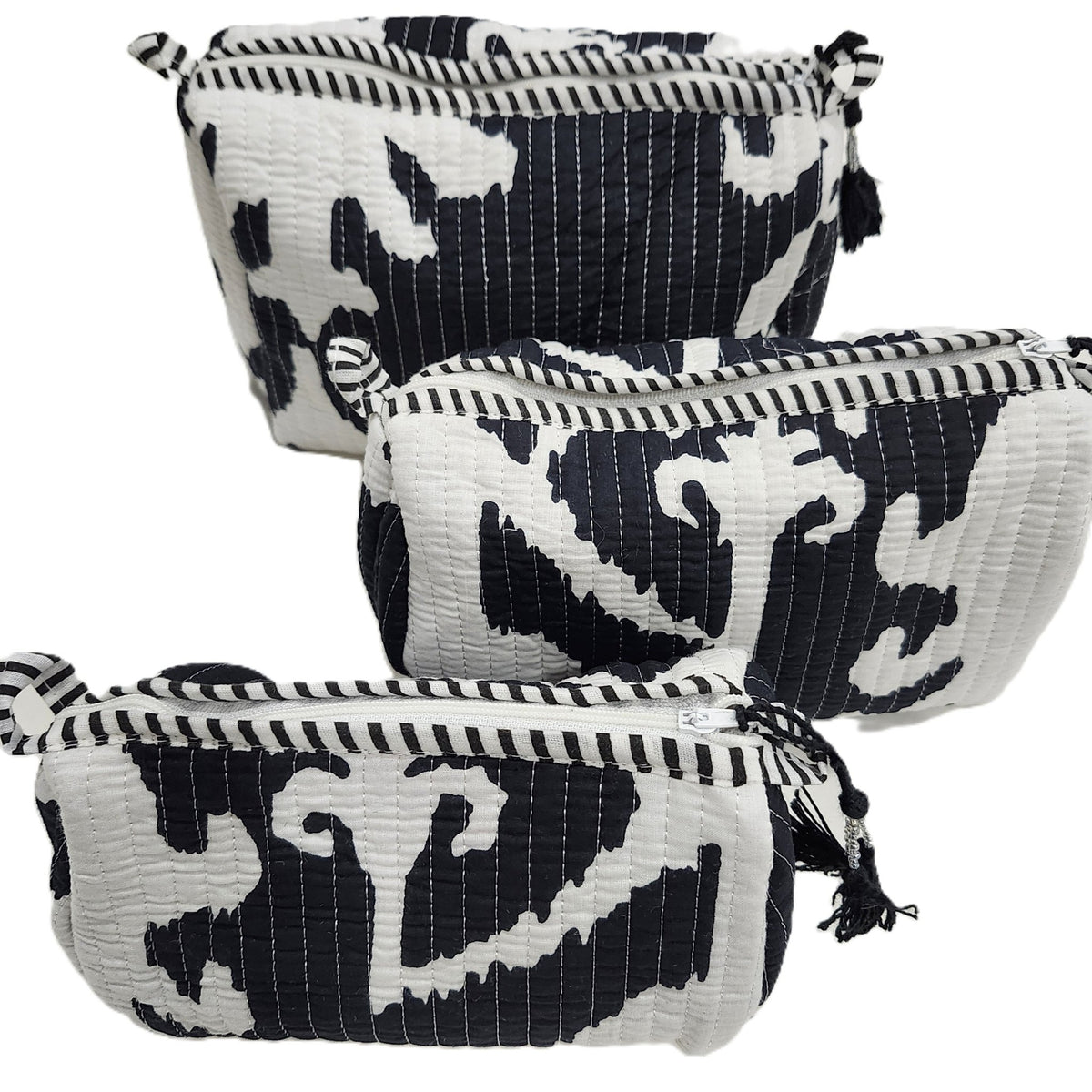 Handmade black and white wash bag in a classic floral block print, with a lined interior, four inner pockets and a sturdy zip