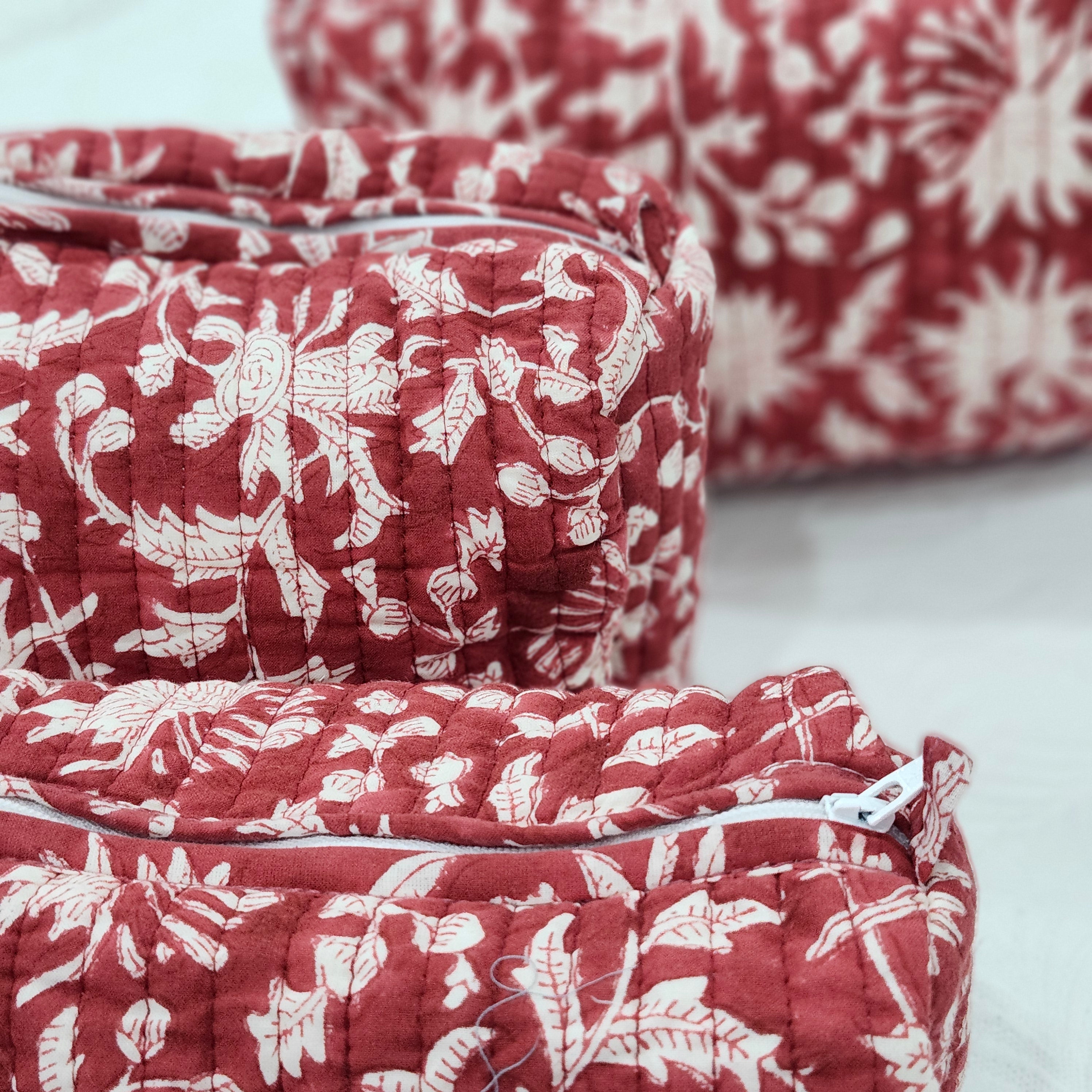 Festive red block-print wash bag with a tassel zip
