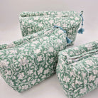 Floral green block-print wash bag with a tassel zip