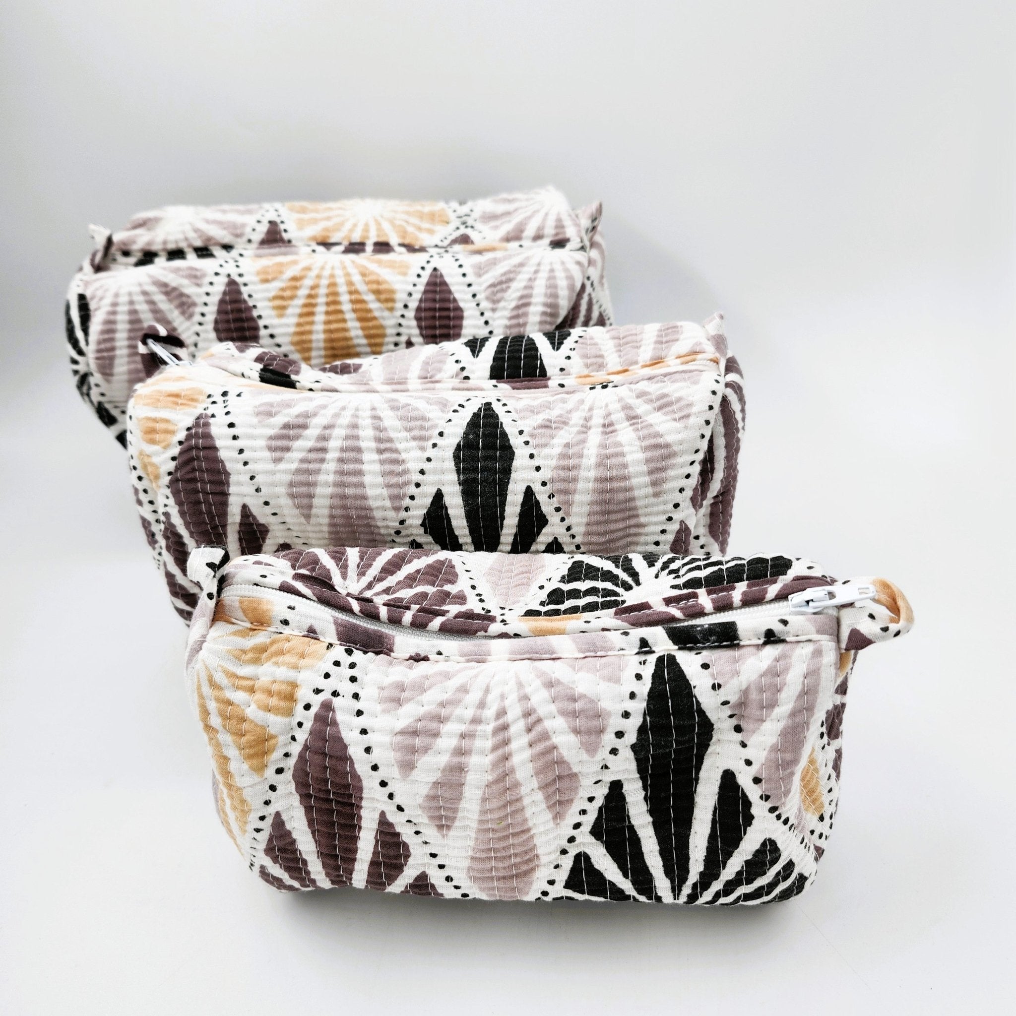 Tribal geometric block-print wash bag in tan, taupe, grey and black
