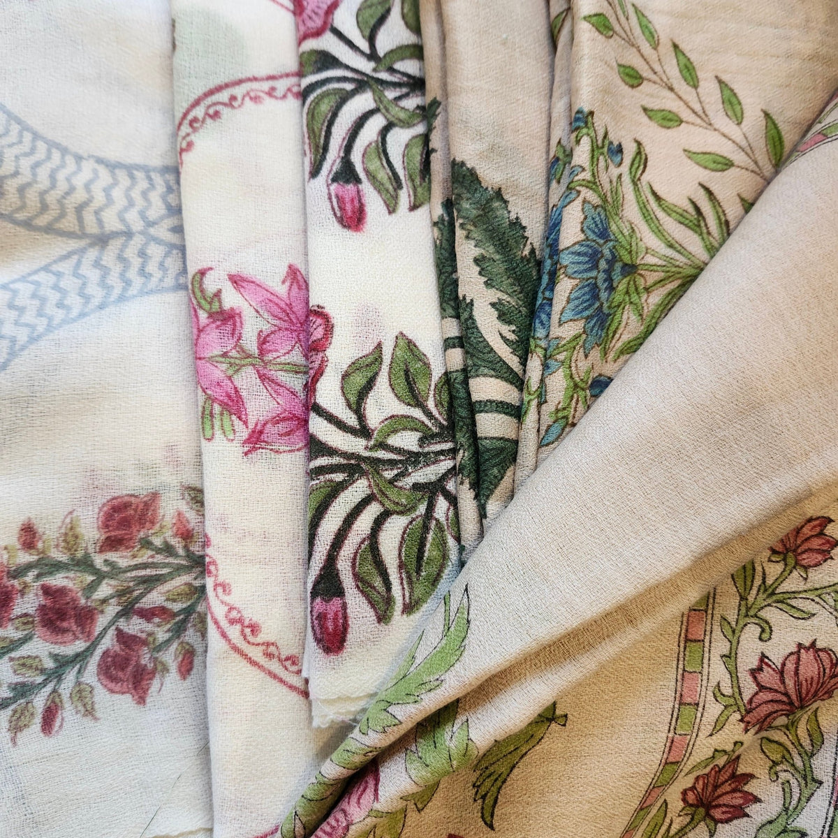 Assorted block print wool shawls in floral and geometric designs, 100 per cent wool, 75 by 200cm.