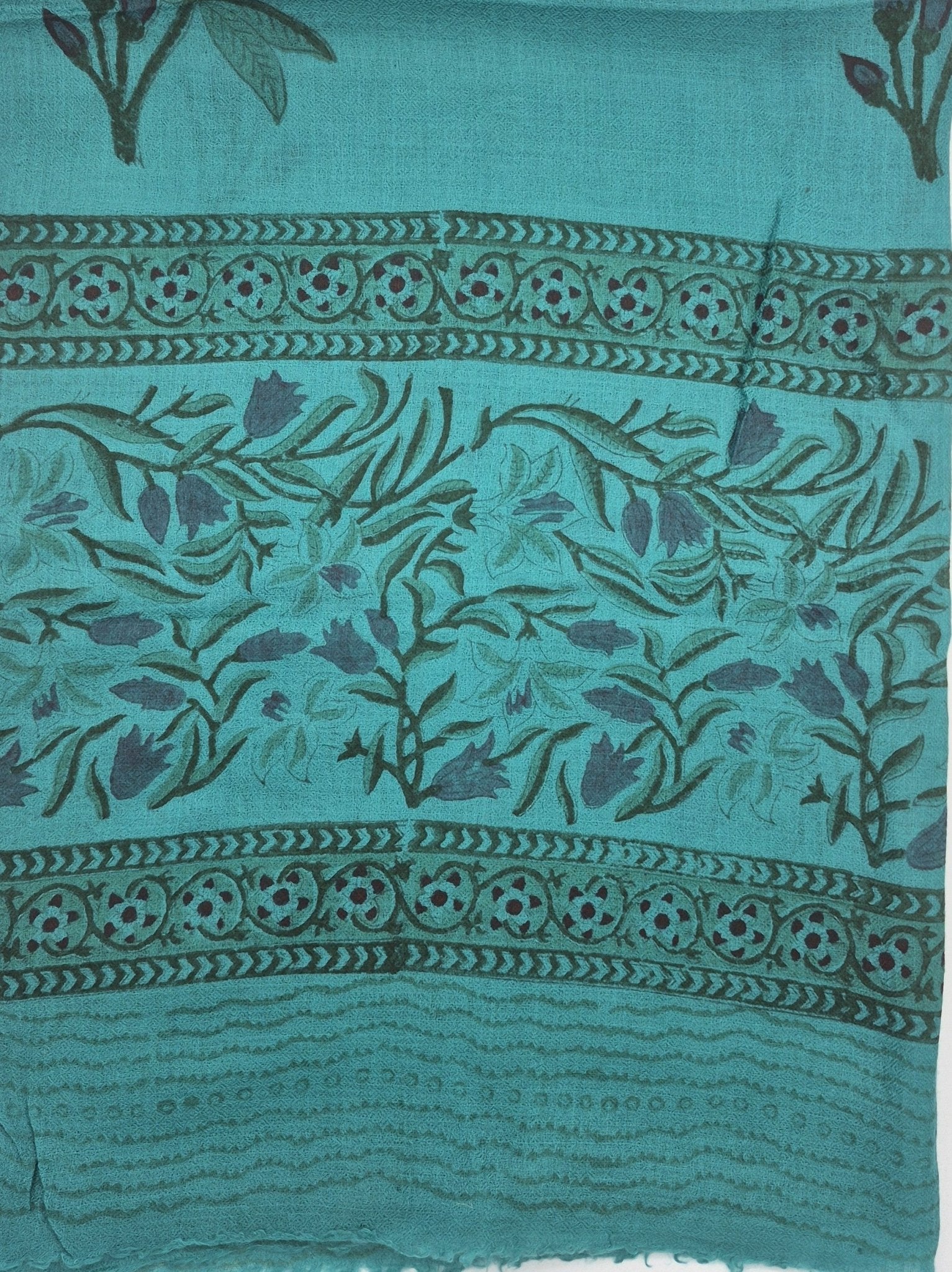 Block print wool shawl in a turquoise tulip design on a pale ground, soft and lightweight, 75 by 200cm.