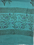 Block print wool shawl in a turquoise tulip design on a pale ground, soft and lightweight, 75 by 200cm.